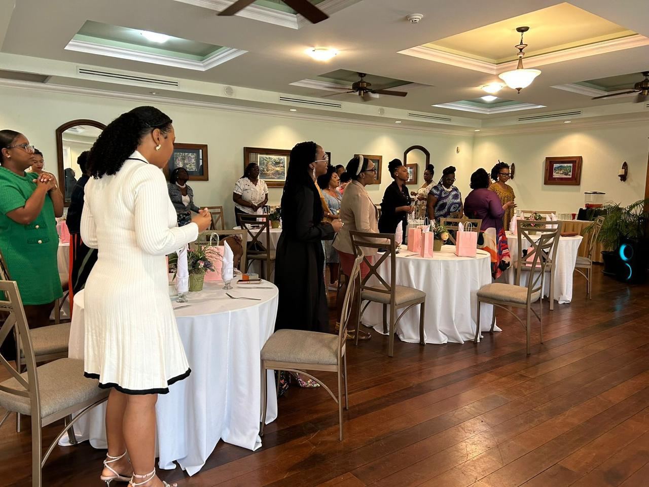 Women gathered together at a ReviveHer Conference session